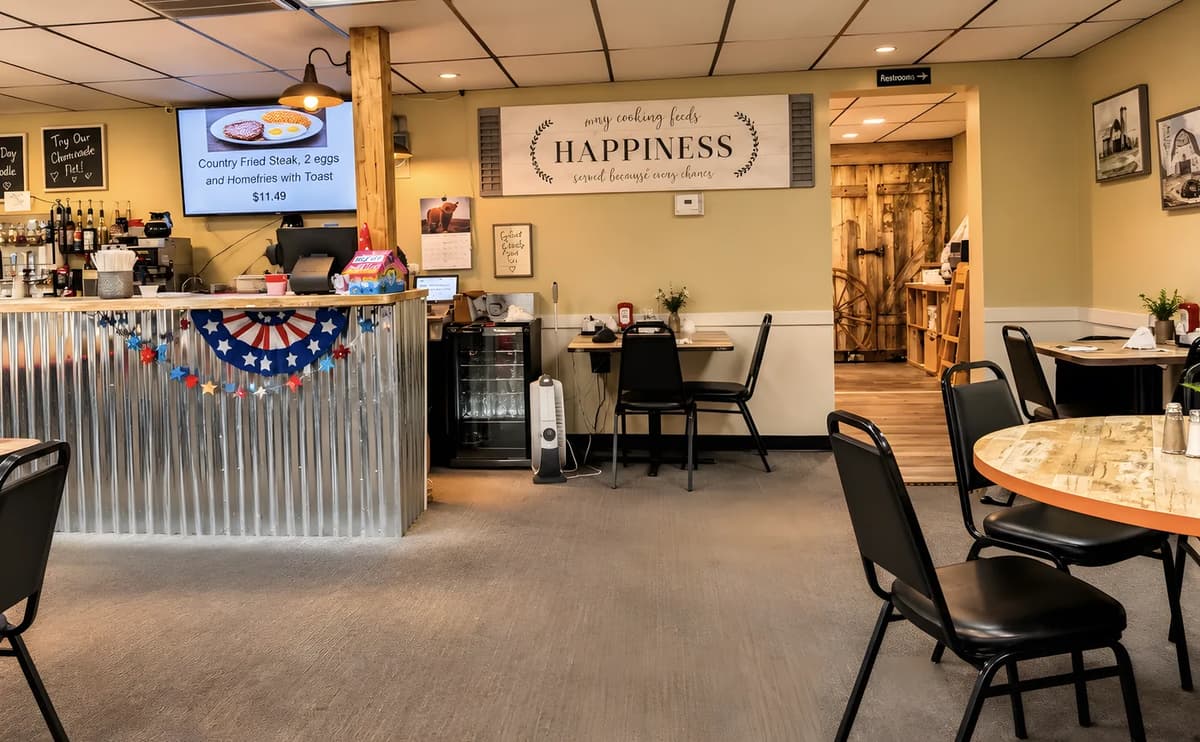The dining room and counter at Greenwood Steakhouse